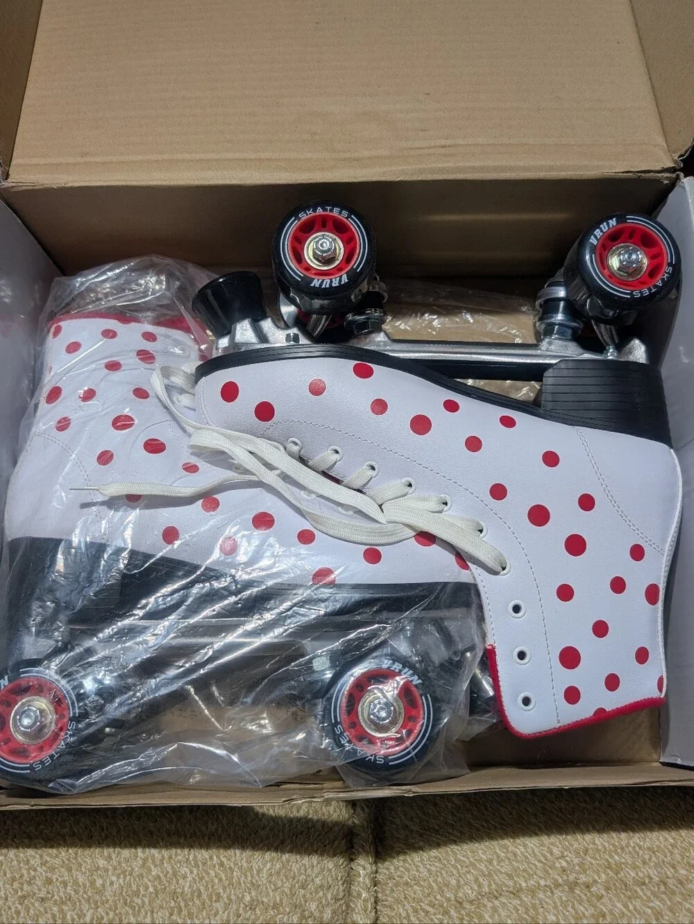 Classic White Roller Skates with Red Polka Dot Accent